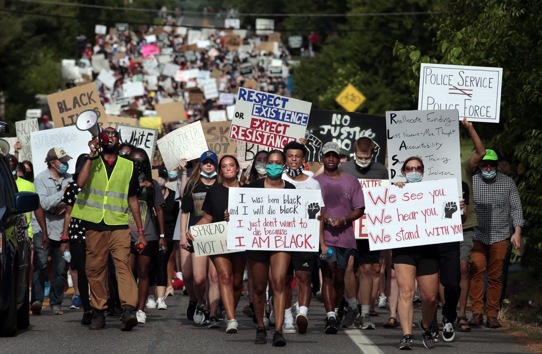 Youth march moves through wealthy suburbs